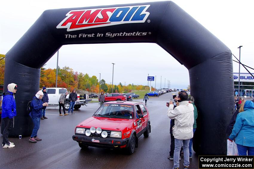 Nino Ortega / Jason Cook VW GTI leaves the ceremonial start.