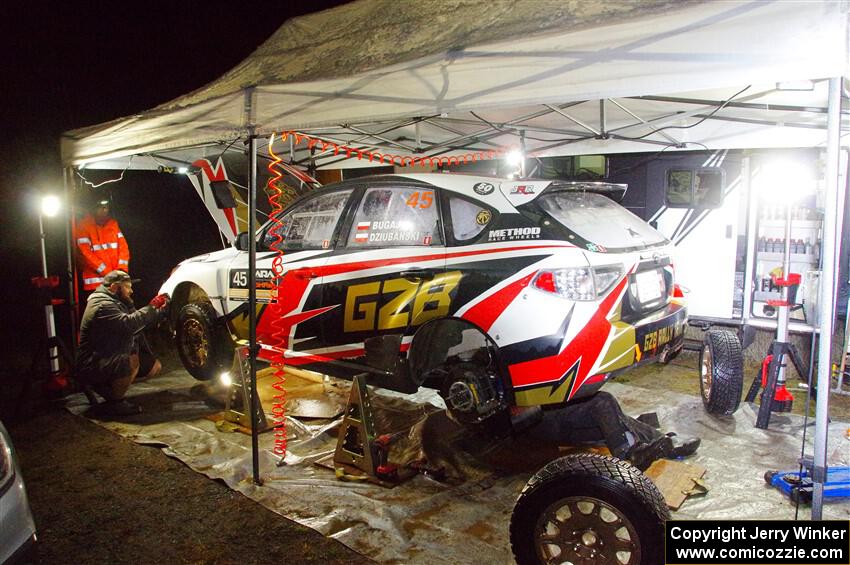 Grzegorz Bugaj / Ela Dziubanski Subaru WRX STi at service in Sidnaw after day one.