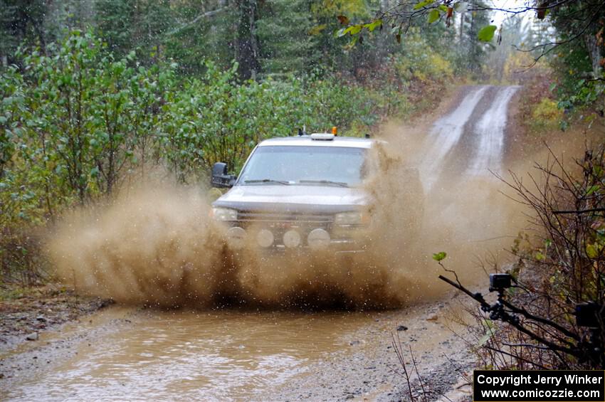 A GMC Sierra pickup sweeps SS9, Nestoria-Herman.