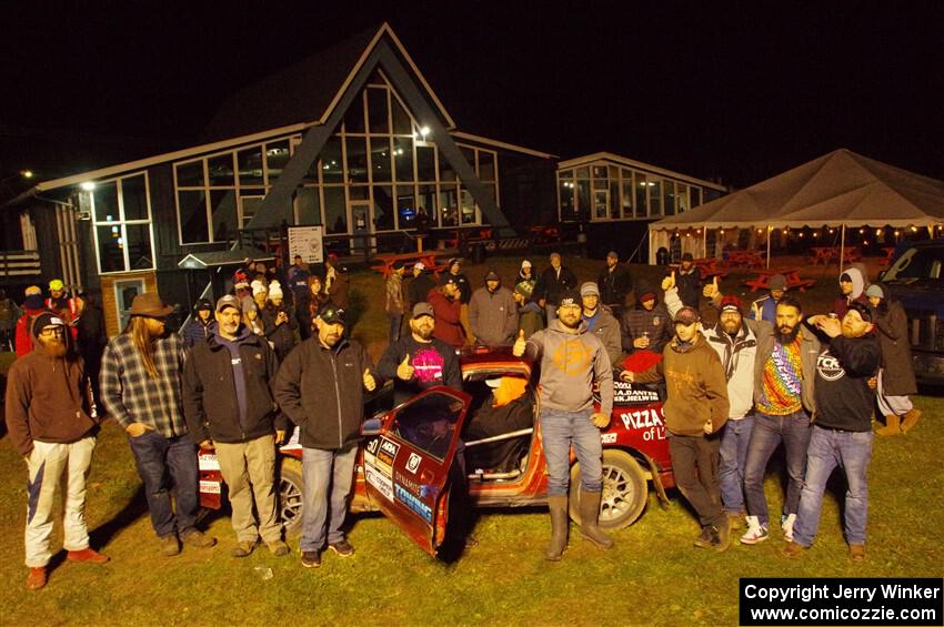 Former crew and co-drivers pose with the Al Dantes, Jr. Mazda RX-7 LS.