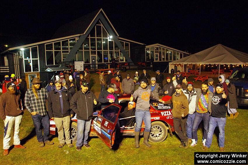 Former crew and co-drivers pose with the Al Dantes, Jr. Mazda RX-7 LS.