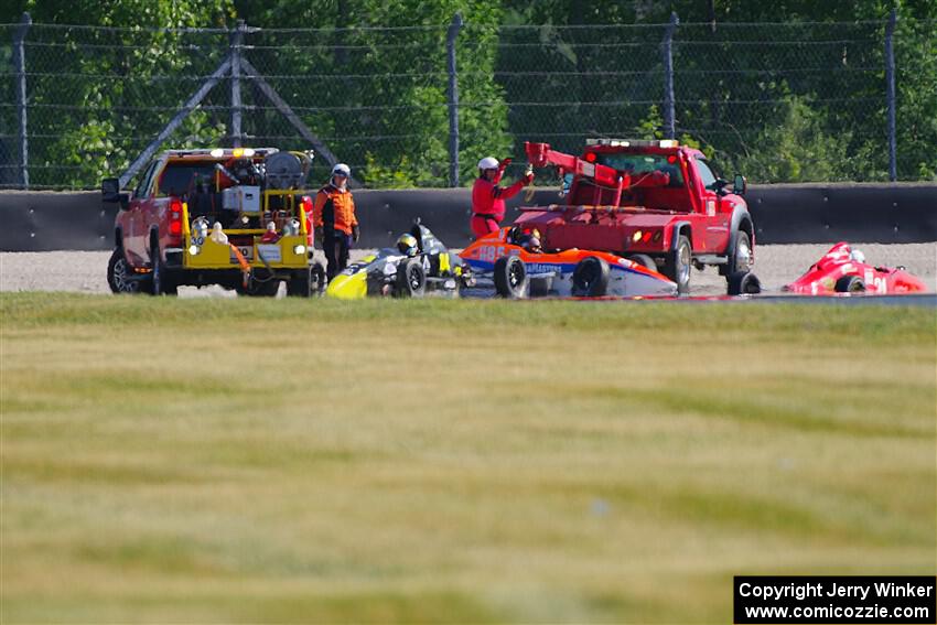 Three cars tangled on the first turn of lap one, race 1.