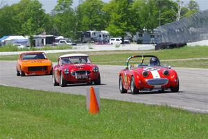 John Daniels, Jr.'s Austin-Healey Sprite, Scott McQueen's Austin-Healey 100-6 and Tim Homes' Datsun 240Z