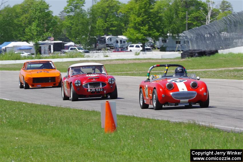 John Daniels, Jr.'s Austin-Healey Sprite, Scott McQueen's Austin-Healey 100-6 and Tim Homes' Datsun 240Z