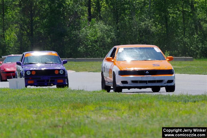 Sam Fisher's ITA Nissan 200SX SE-R and Dave LaFavor's ITS BMW 325is