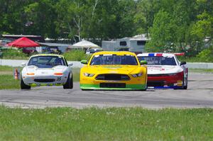 Matt Gray's GT-2 Ford Mustang, Patrick Utt's GT-2 Chevy Camaro and Dan Corgard's Spec Miata Mazda Miata