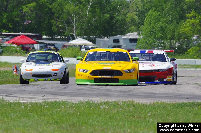 Matt Gray's GT-2 Ford Mustang, Patrick Utt's GT-2 Chevy Camaro and Dan Corgard's Spec Miata Mazda Miata