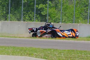 Ben Jacobs' Spec Racer Ford 3 slides against the turn 2 wall after an accident.