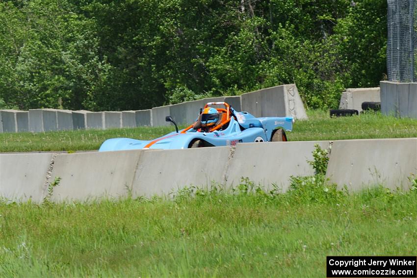 Andrea King's Spec Racer Ford 3 rests at the entrance to turn 2 after an accident.