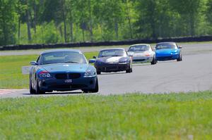 Roger Knuteson's T4 BMW Z4 plus Geoff Youngdahl's, Dan Corgard's and Rick Buan's Spec Miata Mazda Miatas