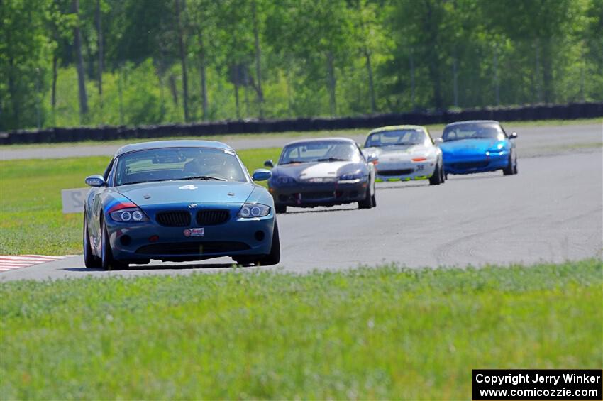 Roger Knuteson's T4 BMW Z4 plus Geoff Youngdahl's, Dan Corgard's and Rick Buan's Spec Miata Mazda Miatas