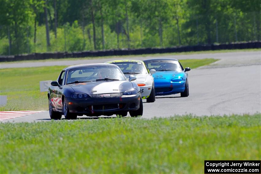 Geoff Youngdahl's, Dan Corgard's and Rick Buan's Spec Miata Mazda Miatas