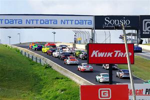 The field heads uphill for the start of the race.