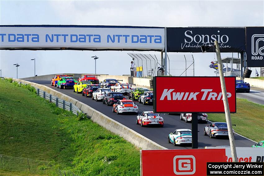 The field heads uphill for the start of the race.