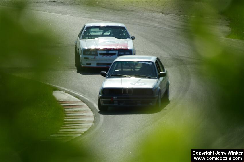 Jeff Johnk's BMW 325i and Steve Martin's Ford Mustang