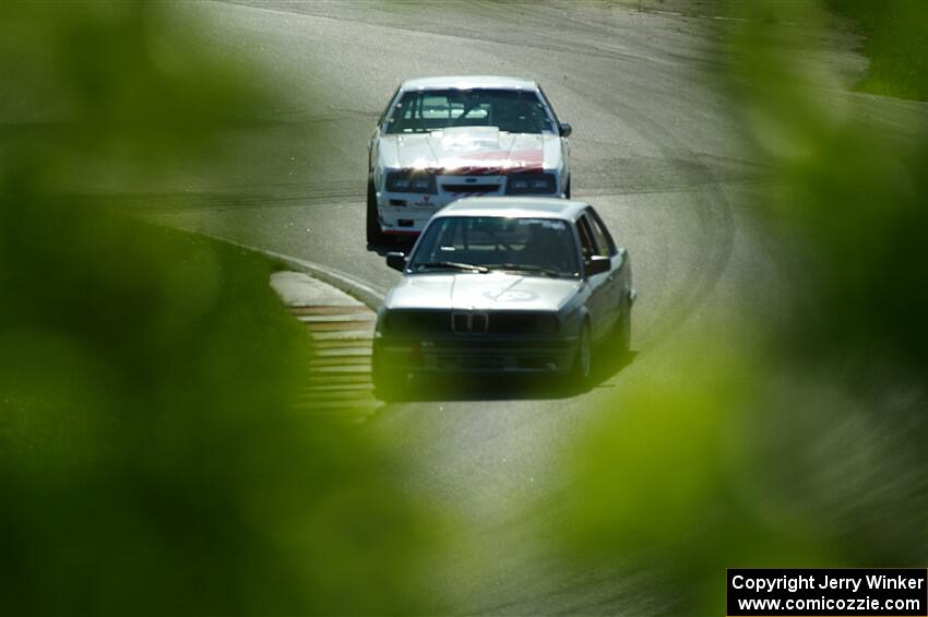 Jeff Johnk's BMW 325i and Steve Martin's Ford Mustang