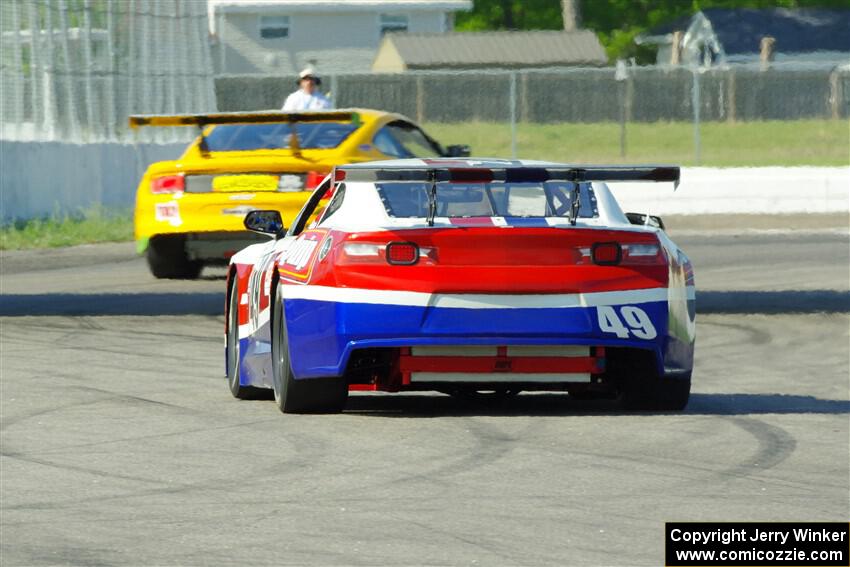 Patrick Utt's GT-2 Chevy Camaro chases Matt Gray's GT-2 Ford Mustang