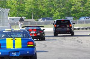 Keith Anderson's SPO Dodge Viper and John Glowaski's ITA Chrysler Neon ACR head for the track exit.