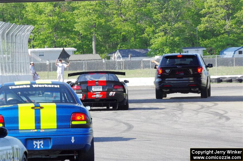 Keith Anderson's SPO Dodge Viper and John Glowaski's ITA Chrysler Neon ACR head for the track exit.