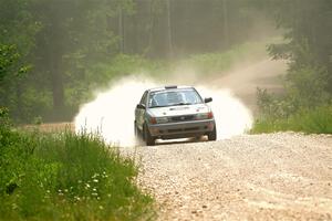 Dexter Clark / Jon McCallie Nissan Sentra SE-R on SS1, Camp 3 North.