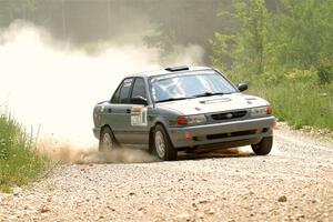 Dexter Clark / Jon McCallie Nissan Sentra SE-R on SS1, Camp 3 North.