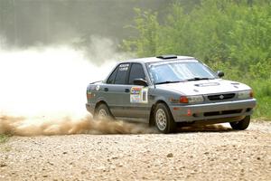 Dexter Clark / Jon McCallie Nissan Sentra SE-R on SS1, Camp 3 North.