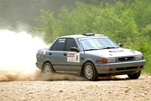 Dexter Clark / Jon McCallie Nissan Sentra SE-R on SS1, Camp 3 North.