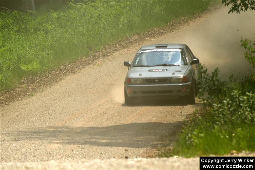 Dexter Clark / Jon McCallie Nissan Sentra SE-R on SS1, Camp 3 North.