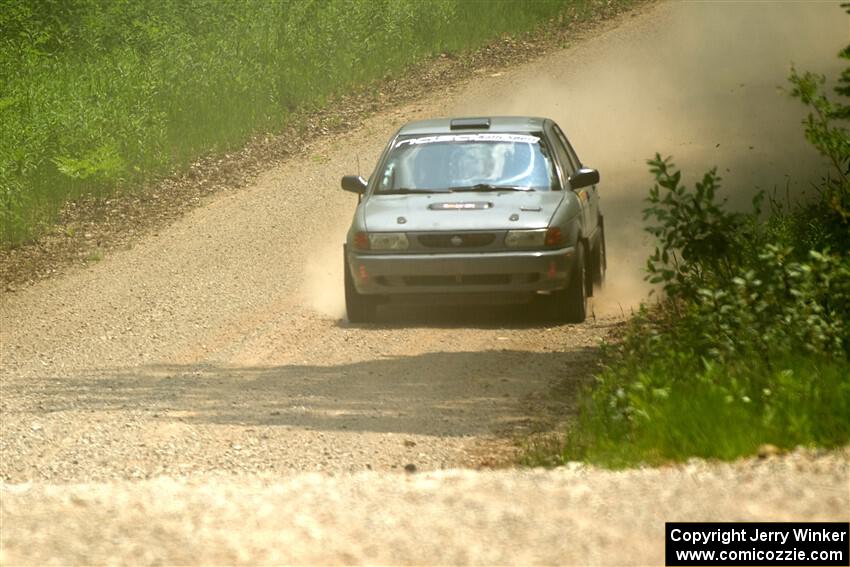 Dexter Clark / Jon McCallie Nissan Sentra SE-R on SS1, Camp 3 North.