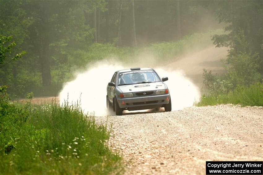 Dexter Clark / Jon McCallie Nissan Sentra SE-R on SS1, Camp 3 North.