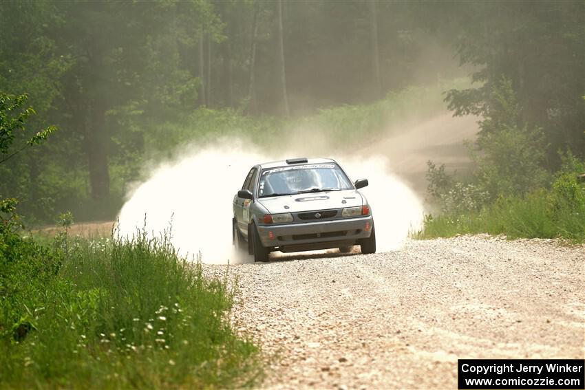 Dexter Clark / Jon McCallie Nissan Sentra SE-R on SS1, Camp 3 North.