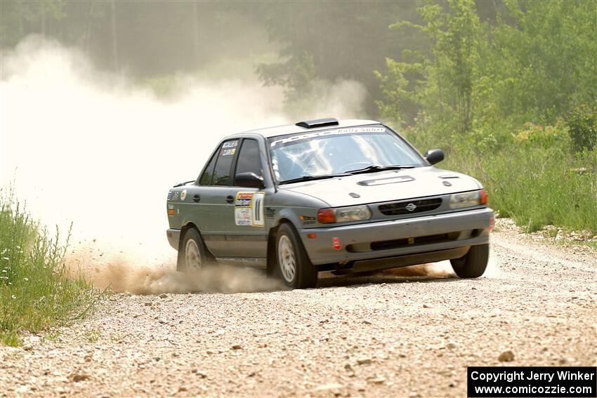 Dexter Clark / Jon McCallie Nissan Sentra SE-R on SS1, Camp 3 North.