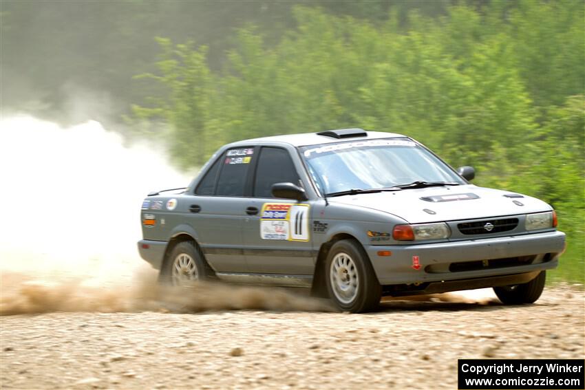 Dexter Clark / Jon McCallie Nissan Sentra SE-R on SS1, Camp 3 North.