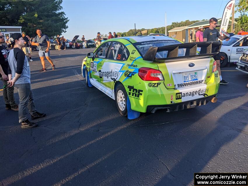 Rob Sanders / Ashley Speare Subaru WRX STi pulls in during Thursday evening's parc expose.