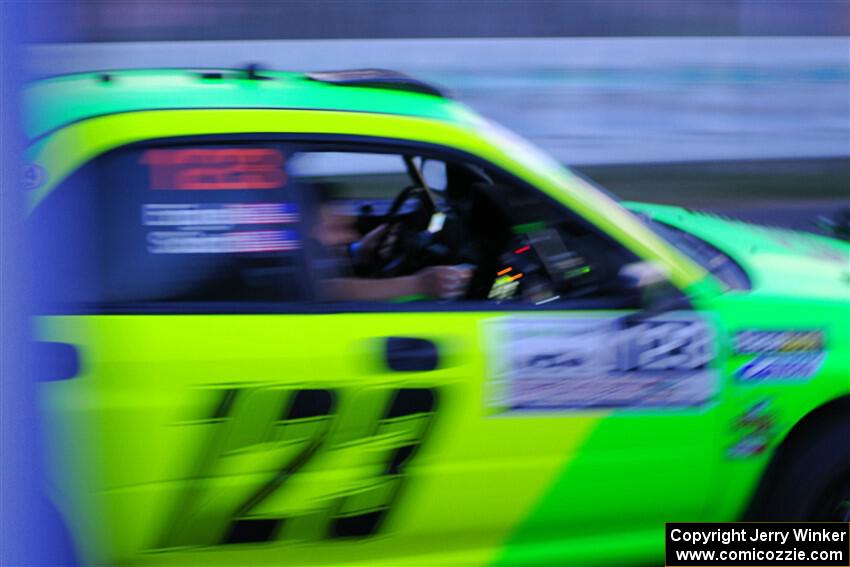 Mike Engle / Ryan Scott Subaru WRX STi leaves the start line for Thursday night's ceremonial start.