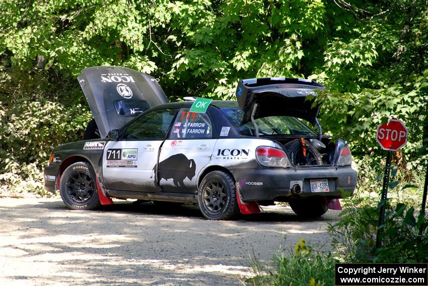 John Farrow / Michael Farrow Subaru WRX stops for repairs on SS2, Refuge I.