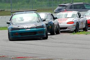 Mark Utecht's ITJ Honda Civic, Sam Nogosek's Spec Miata Mazda and Kyle Greenhill's Spec Miata Mazda Miata