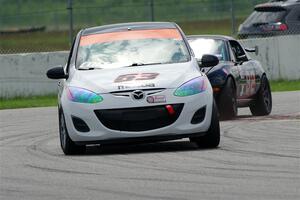 Bill Collins' B-Spec Mazda 2 and Cody Lindman's STL Mazda Miata