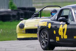 Greg Youngdahl's Spec Miata Mazda Miata and Brooke Fairbanks' H Production Triumph Spitfire