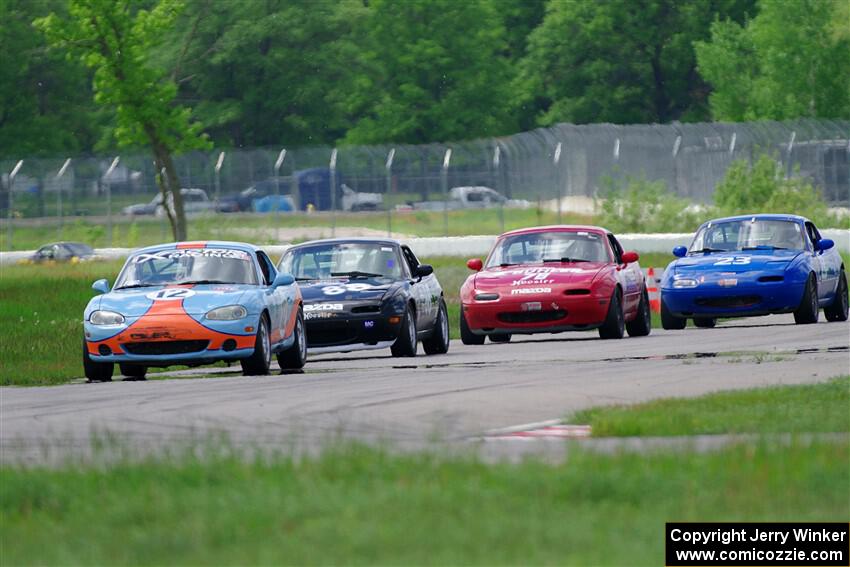 Russell King's, Samantha Silver's, Garrett Taylor's and George Ellis' Spec Miata Mazda Miatas