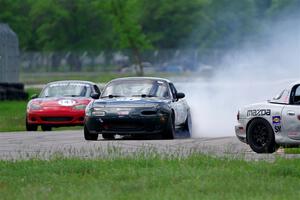 Sam Nogosek's Spec Miata Mazda Miata loses its engine after the finish line.