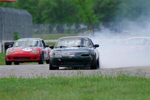 Sam Nogosek's Spec Miata Mazda Miata loses its engine after the finish line.