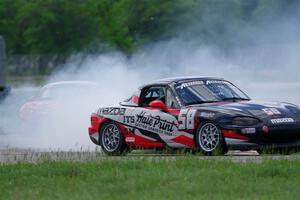 Sam Nogosek's Spec Miata Mazda Miata loses its engine after the finish line.