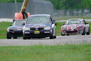 Tom Daly's T4 VW Rabbit, Cody Lindman's STL Mazda Miata and Cohen Craft's Spec Miata Mazda Miata