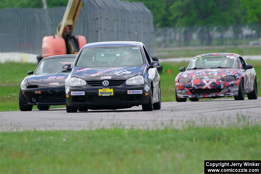 Tom Daly's T4 VW Rabbit, Cody Lindman's STL Mazda Miata and Cohen Craft's Spec Miata Mazda Miata