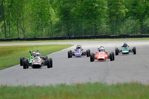 Five vintage Formula Fords come into turn 4.