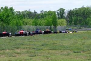 The Spec Racer Ford 3 field heads between turns 6 and 7 on the pace lap.