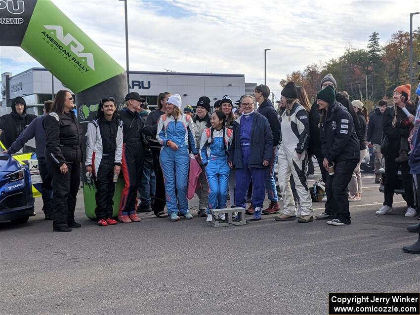 Women drivers and navigators gather for a group shot before the ceremonial start.