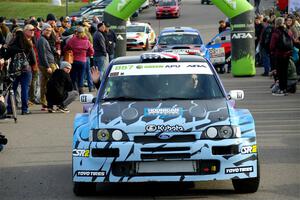 Lia Block / Rhianon Gelsomino Ford Escort Cosworth RS leaves the ceremonial start.