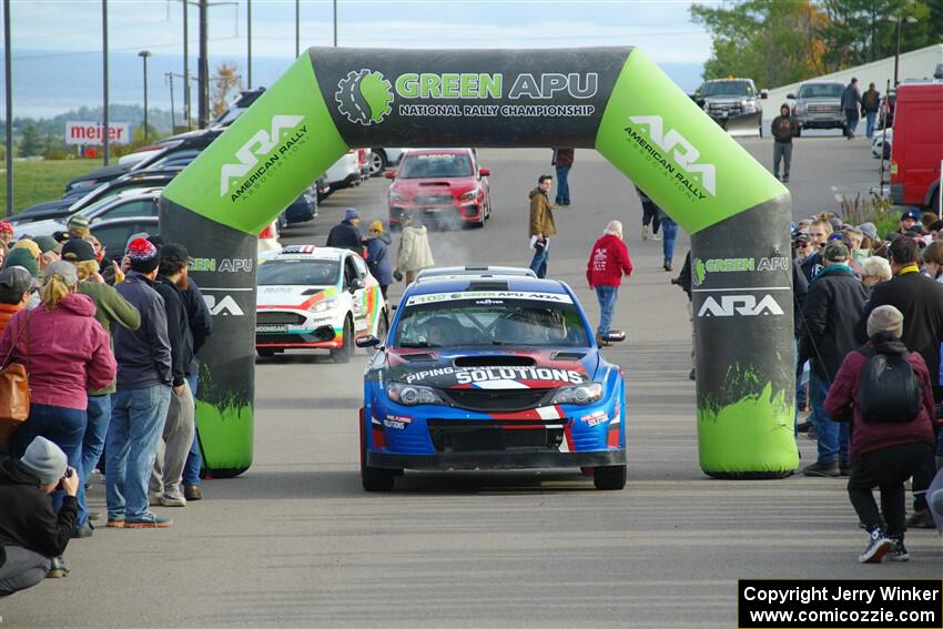 Arek Bialobrzeski / Aris Mantopoulos Subaru WRX STi leaves the ceremonial start.